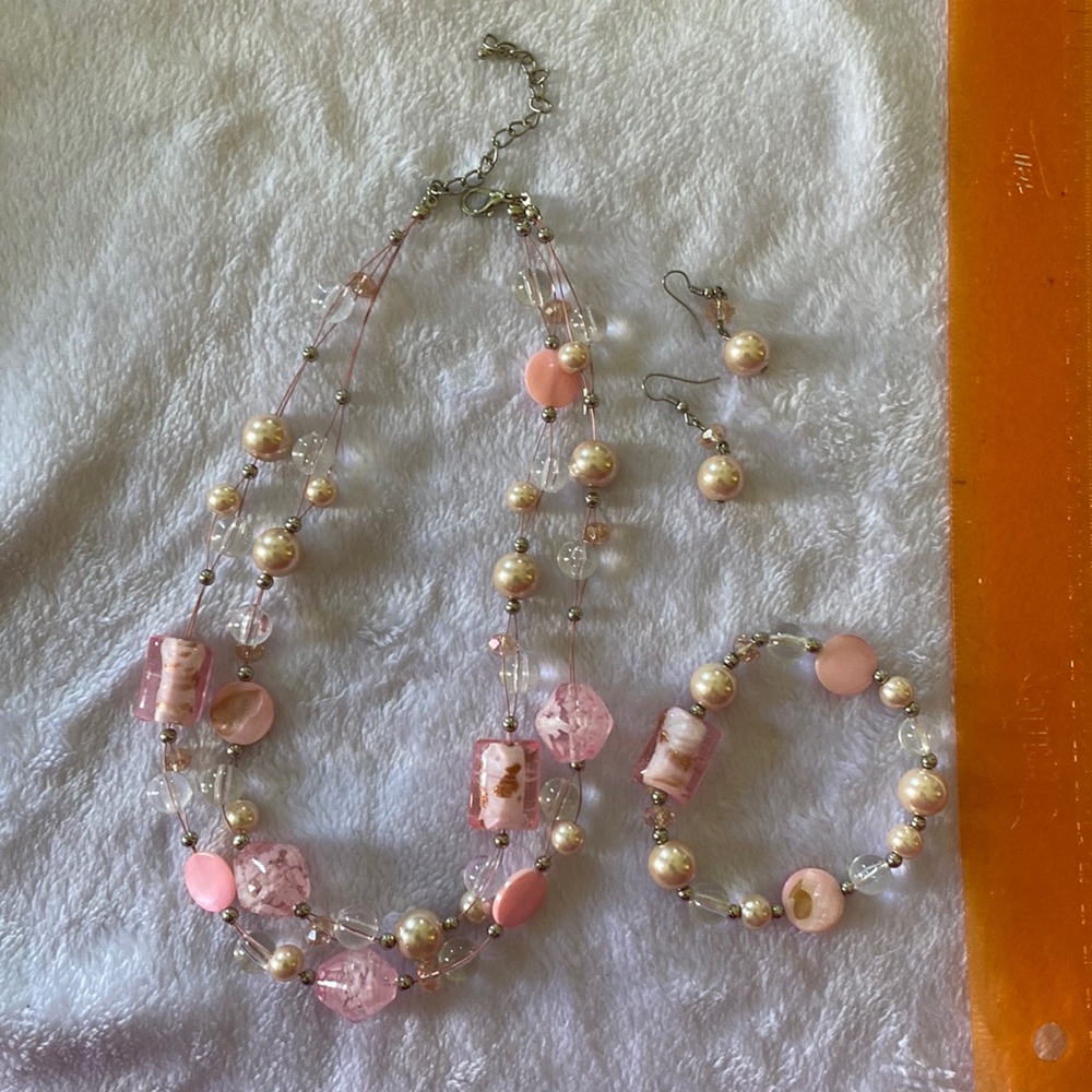 Pink pearl necklace, earring and bracelet set.